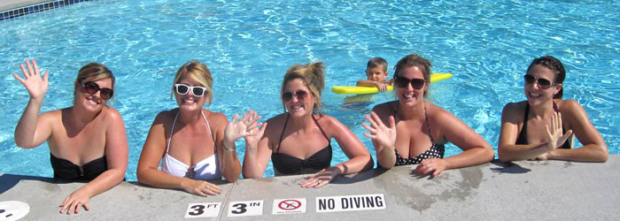 Five women relaxing in the pool